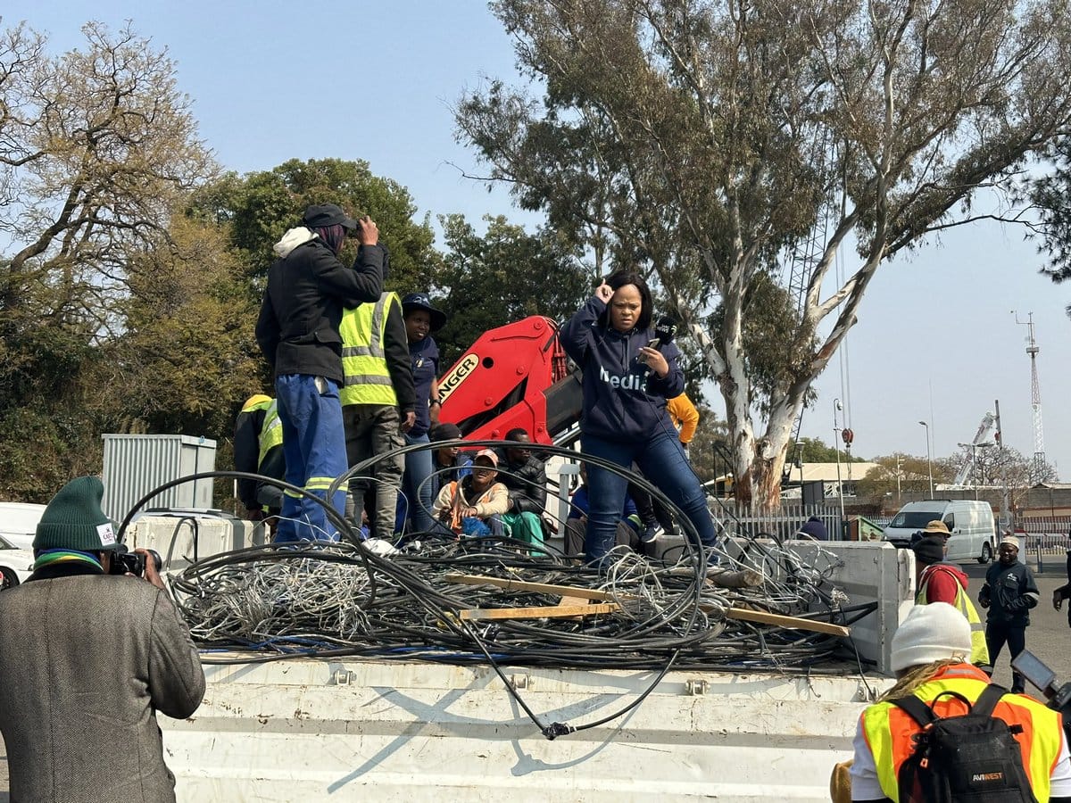 City Power technicians at work, disconnecting illegal electricity connections to reduce the load on the grid and ensure fair distribution of power resources.
