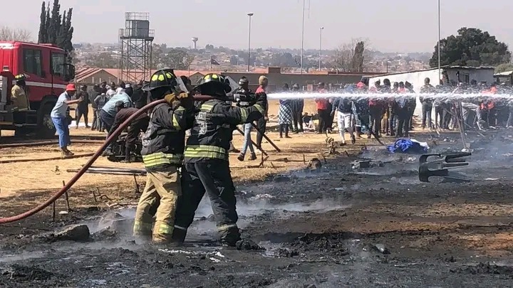 Image of Pastor Mboro's church in flames, with a caption highlighting community outrage over school abduction incident"