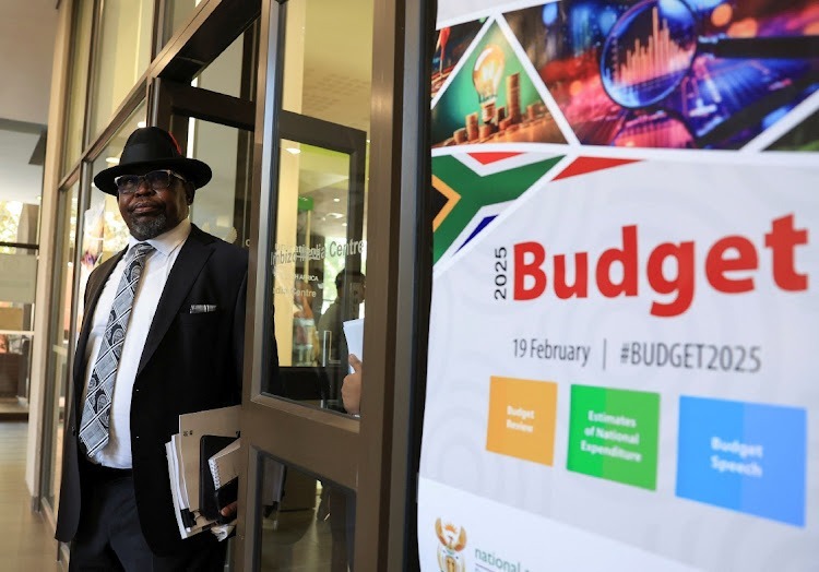 South Africa's Finance Minister Enoch Godongwana leaves after a press conference ahead of his 2025 budget speech in Cape Town, South Africa, February 19, 2025. Image: Esa Alexander