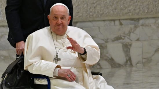 Pope Francis, seen here in a recent public appearance, continues his recovery from a respiratory infection. The Vatican reports slight improvements in his condition as he gradually reduces dependence on assisted breathing. Photo credit: AFP.