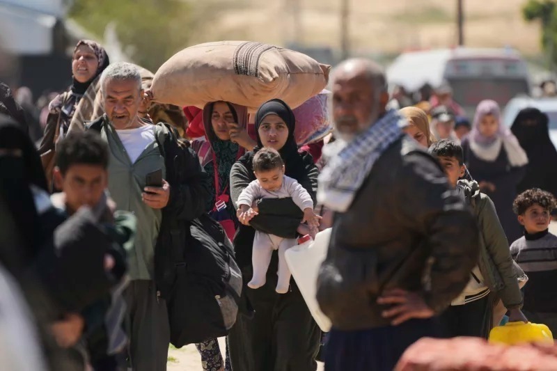 Displaced Palestinians flee from Rafah amid ongoing Israeli military operations following Israel's renewed offensive in the Gaza Strip, arrive in Khan Younis, Gaza, on Sunday. Image: AP.
