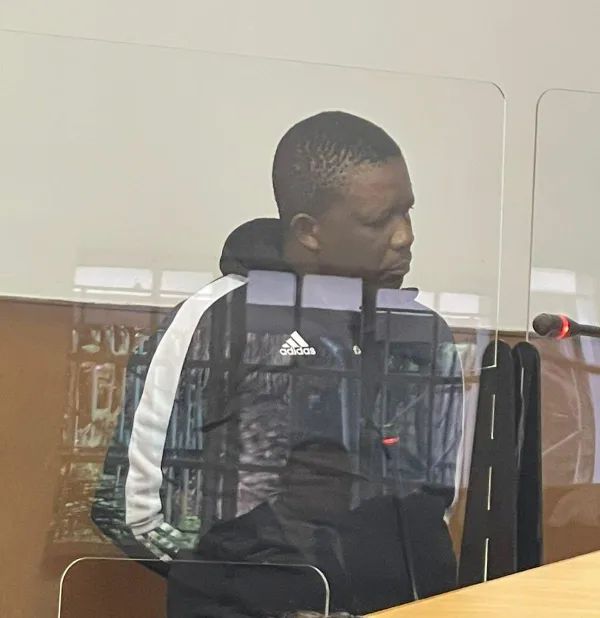 Thabo Theletsane appears in the Hatfield Magistrate’s Court on charges of fraud and impersonation after allegedly posing as Hawks head Godfrey Lebeya to scam a businessman out of over R100,000. Image : supplied