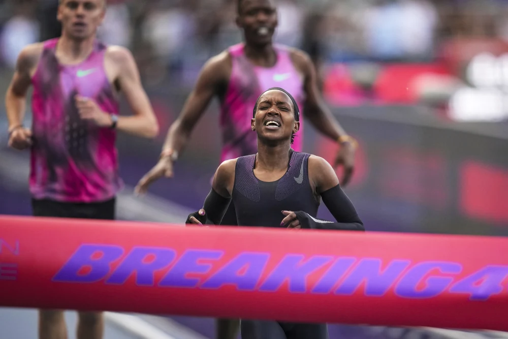 Faith Kipyegon catches her breath after pushing the limits in her sub-four-minute mile attempt at Stade Charléty. Image: Christopher Ena/AP.
