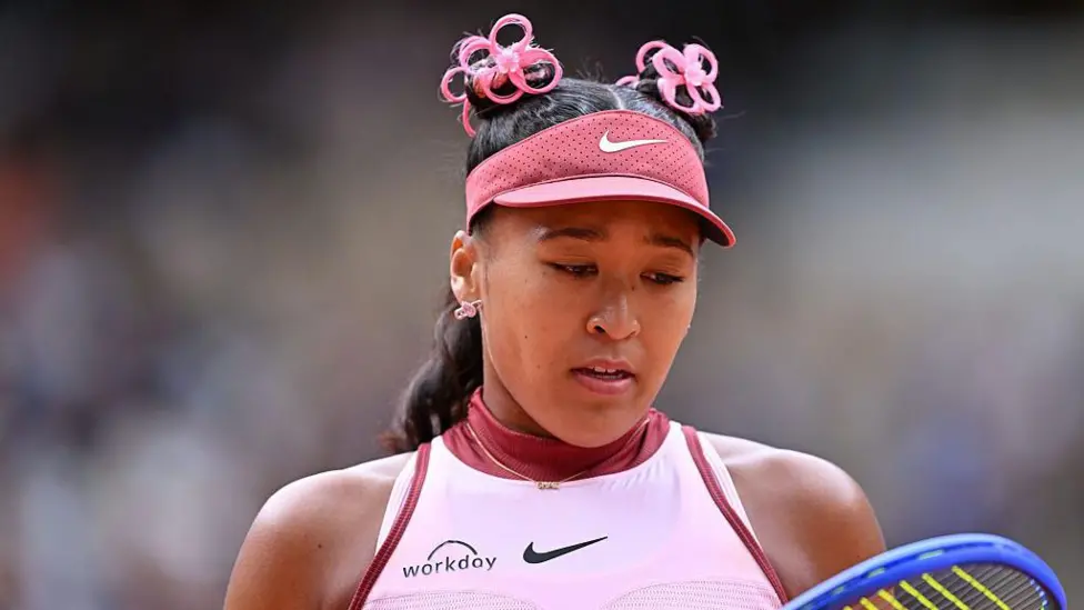 Naomi Osaka celebrates a hard-fought grass-court win, marking her first of the season as she builds towards Wimbledon. Image: Getty Images.
