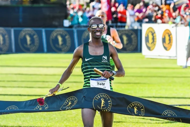 Tete Dijana crosses the finish line to claim his third Comrades Marathon title, holding off rival Piet Wiersma in a dramatic sprint to the end. Image: Gallo Images.