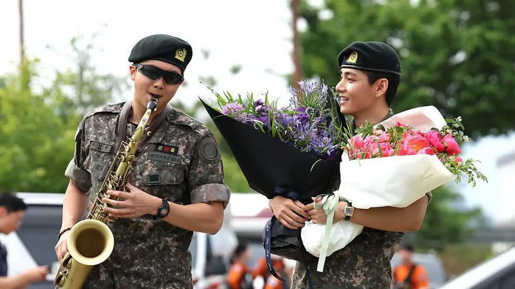 BTS leader RM serenades the crowd outside the South Korean military base in Chuncheon, Gangwon Province, as he and V are released from mandatory military service on June 10th. Image: AFP/Shin Yong-ju.