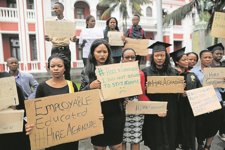 Frustrated by the pervasive youth unemployment in South Africa, educated young people, some in graduation attire, protest the disheartening paradox of being qualified yet unable to secure employment. Credit: Mail&Guardian