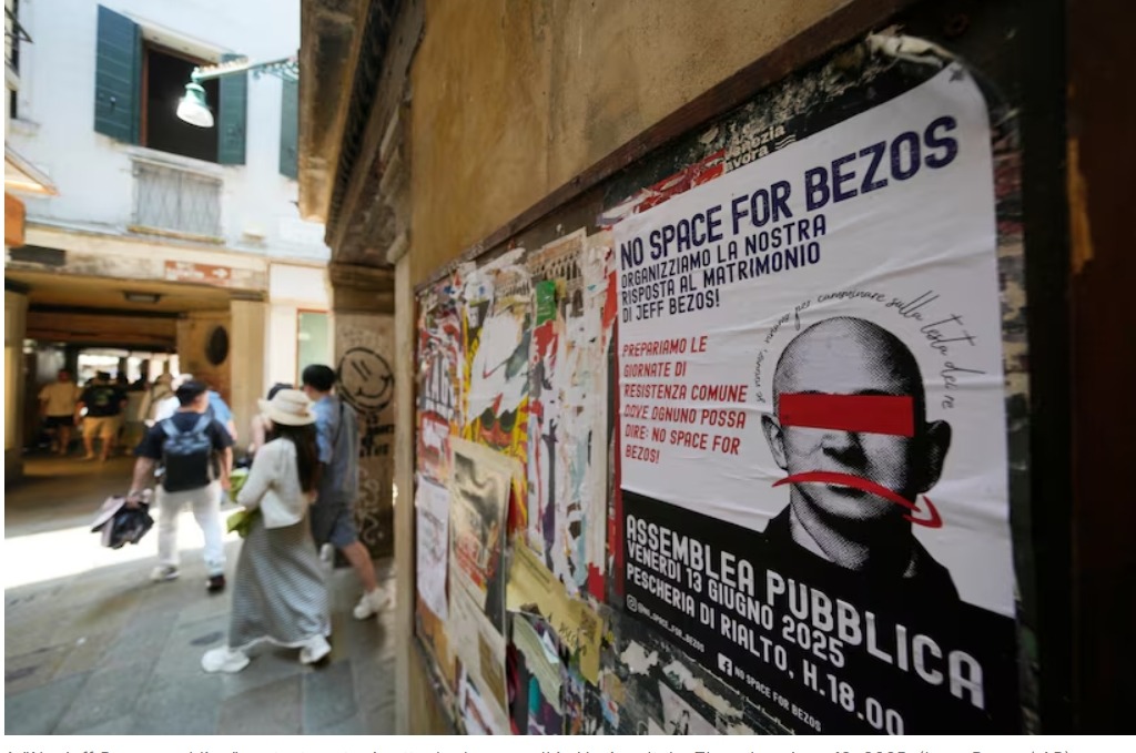 A "No Jeff Bezos wedding" protest poster is attached on a wall in Venice, Italy, Thursday, June 12, 2025. [Luca Bruno / AP]