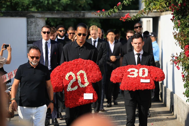Liverpool's captain Virgil van Dijk and Liverpool's player Andrew Robertson arrive holding a flower sheath of Jota's and Silva's Shirt number.