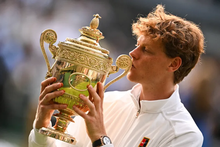 Jannik Sinner lifts his first Wimbledon trophy, becoming the first Italian to win the men’s title at the All England Club.