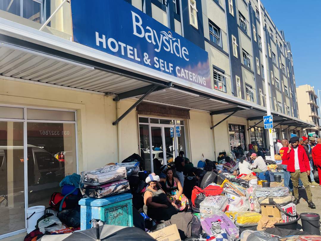 Displaced flood survivors sleep outside Durban’s Bayside Hotel after eviction. Families, including children and the elderly, were left without shelter on Tuesday night.