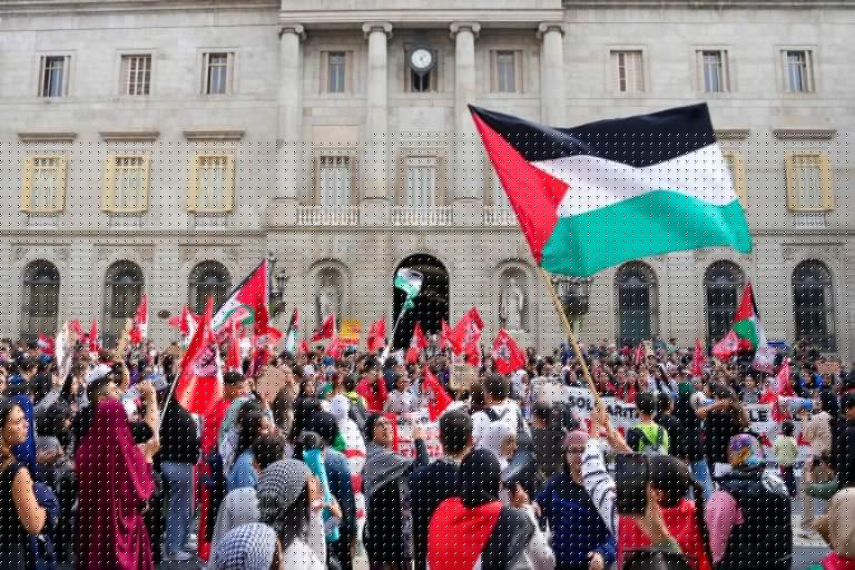 Barcelona, Spain, wave Palestinian flags and rally as part of the worldwide Gaza War protests, calling for action against Israel and demanding an end to the conflict.