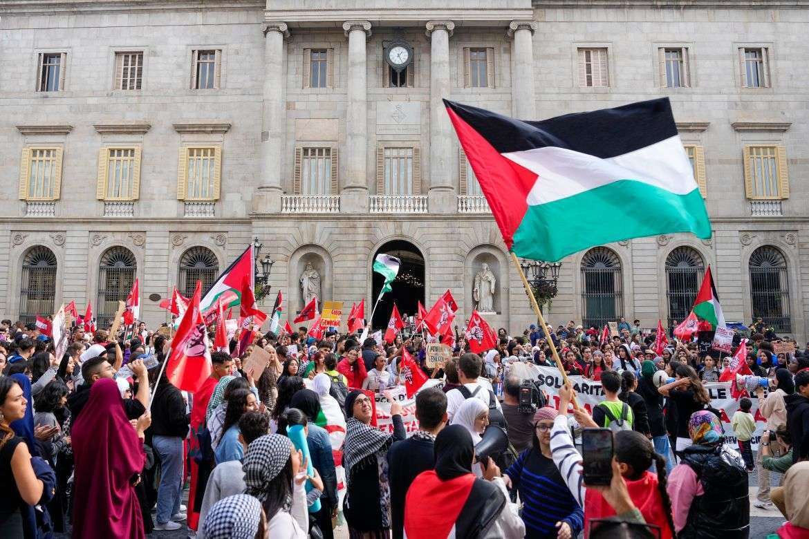 Barcelona, Spain, wave Palestinian flags and rally as part of the worldwide Gaza War protests, calling for action against Israel and demanding an end to the conflict.