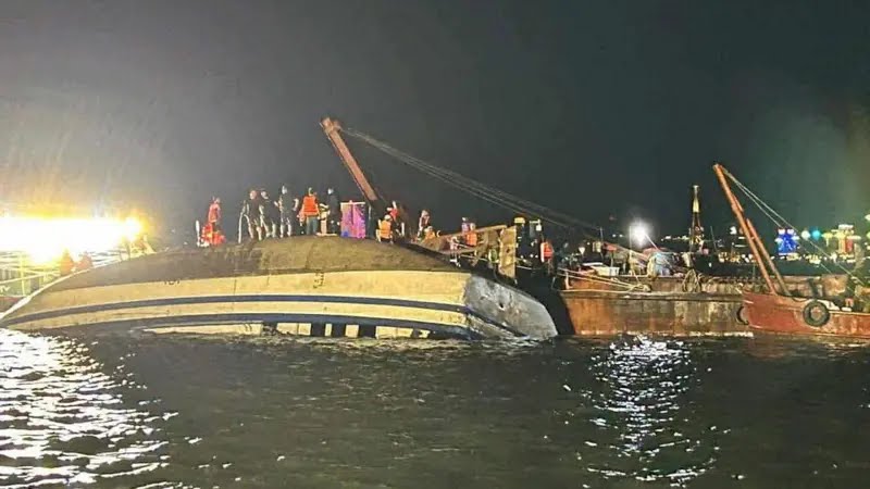 Rescuers at work on the capsized tourist boat in Ha Long Bay, Vietnam, following a sudden storm.