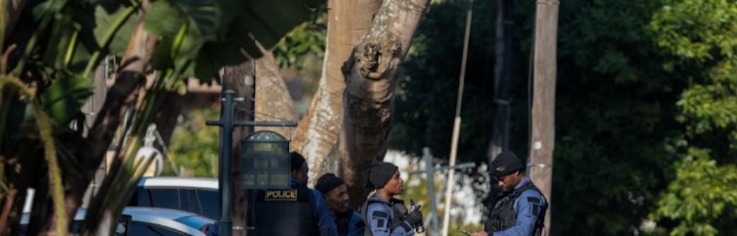 Heavily armed National Intervention Unit members stand guard outside Lieutenant General Nhlanhla Mkhwanazi's residence in Durban.