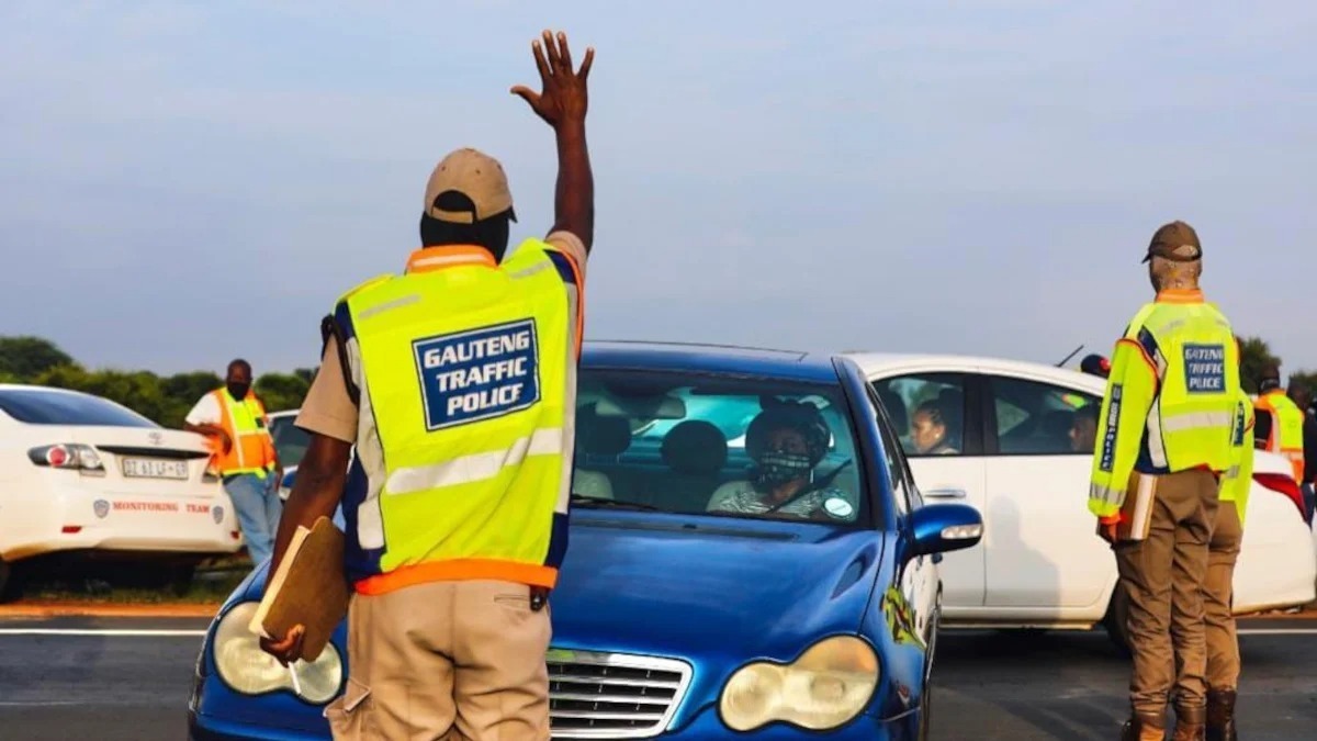 Gauteng Traffic Police officers stop a motorist during routine checks — scenes like this will become more frequent as the AARTO system rolls out nationally from December 2025.