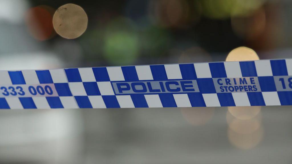Caption: Police tape highlights the serious nature of the ongoing investigation into the allegations against a Melbourne childcare worker. Credit: Getty Images