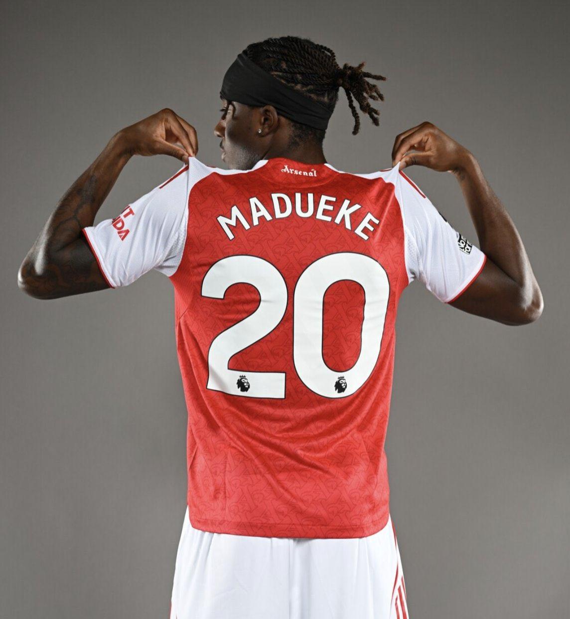Noni Madueke wearing an Arsenal jersey.