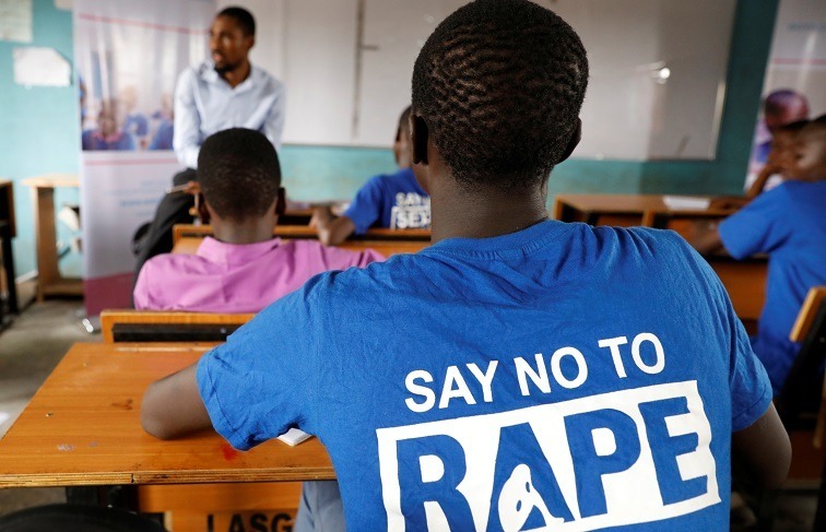 School Sexual Assault: Principal Arrested in Lebowakgomo 1 School sexual assault awareness: A learner in a classroom wears a blue T-shirt with the message “Say No to Rape” while listening to a teacher giving a lesson, highlighting efforts to educate students about preventing sexual violence.