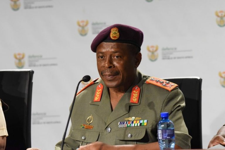 General Rudzani Maphwanya of the South African National Defence Force speaks at a press conference wearing full military uniform.