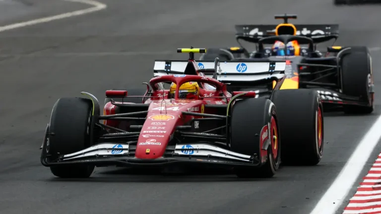 A dejected Lewis Hamilton and a frustrated Charles Leclerc walk away from Hungary with nothing to celebrate, just a day after Ferrari’s pole-position high. Image: Getty Images.