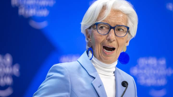 Christine Lagarde speaking at a press event, cautioning against Trump's pressure on US Federal Reserve