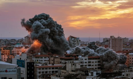 Plumes of smoke rise above Gaza City after Israeli airstrikes destroyed a residential high-rise building
