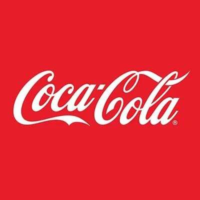Coca-Cola South Africa job cuts article featuring the Coca-Cola logo in white text on a red background.