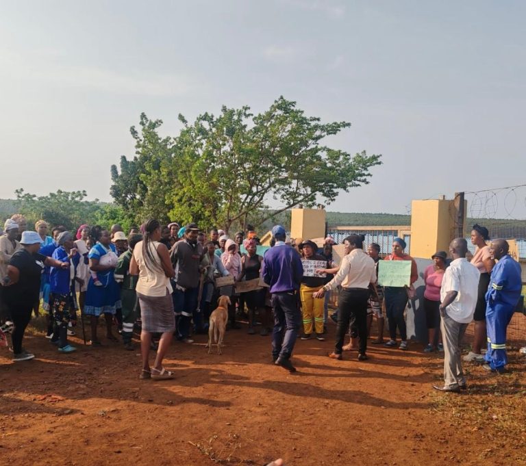 Parents and community members protesting at the gates of Iqhubekani Primary School in Mtubatuba, KwaZulu-Natal, demanding justice for volunteer teacher Miss Mbatha.