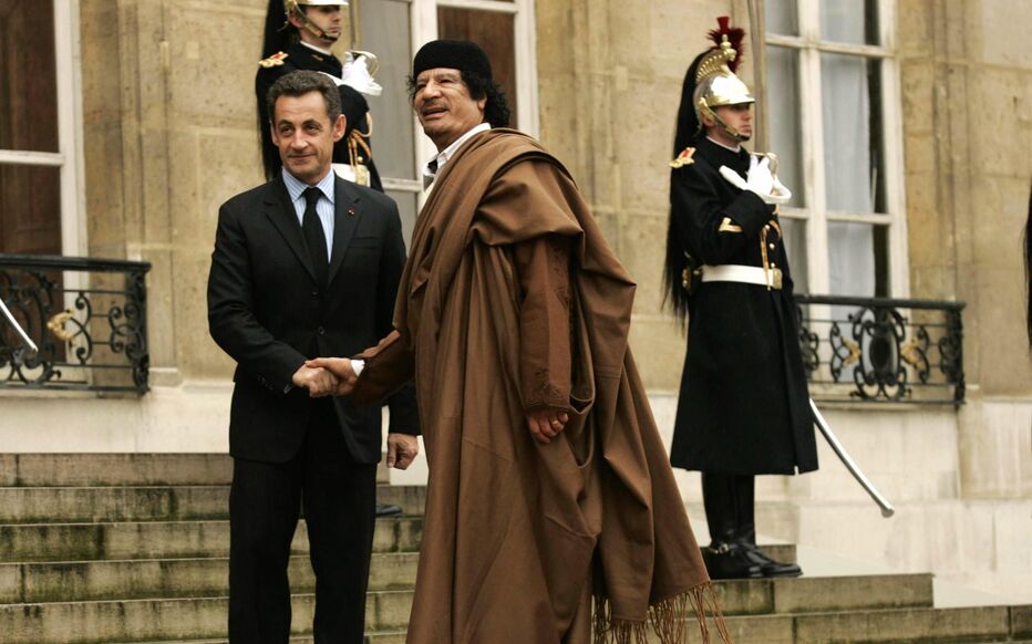 Former French President Nicolas Sarkozy and Former Libyan Leader Muammar Gaddafi