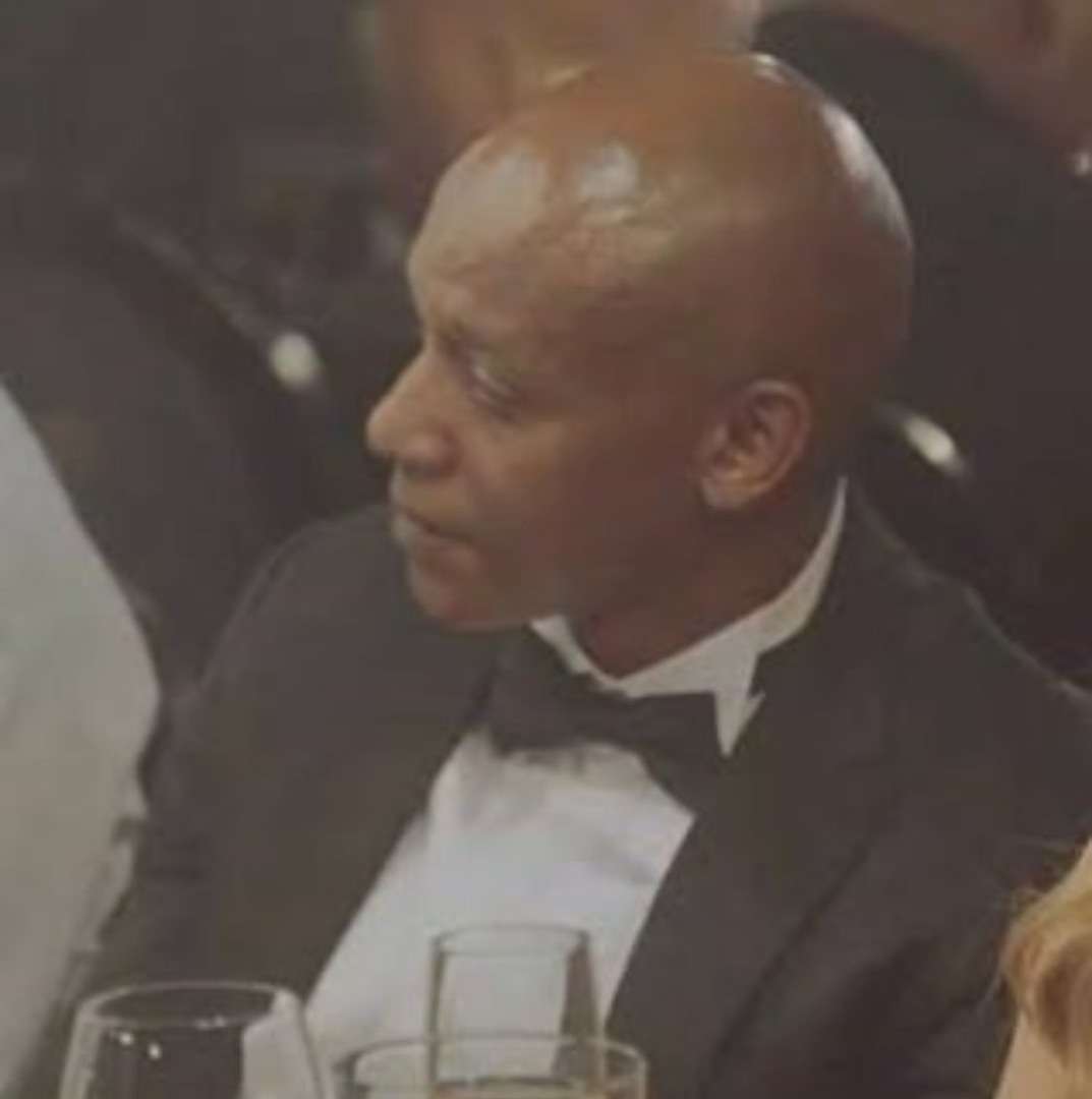 R326M Syndicate suspect Hangwani Maumela in formal attire at a dinner event.