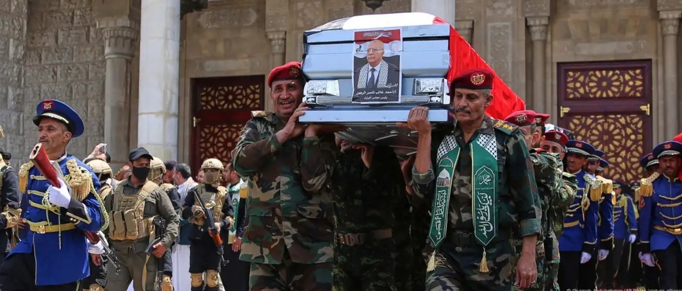 Yemen Houthis officers in Sanaa, Yemen capital, carry the coffin of Prime Minister Ahmed al-Rahawi
