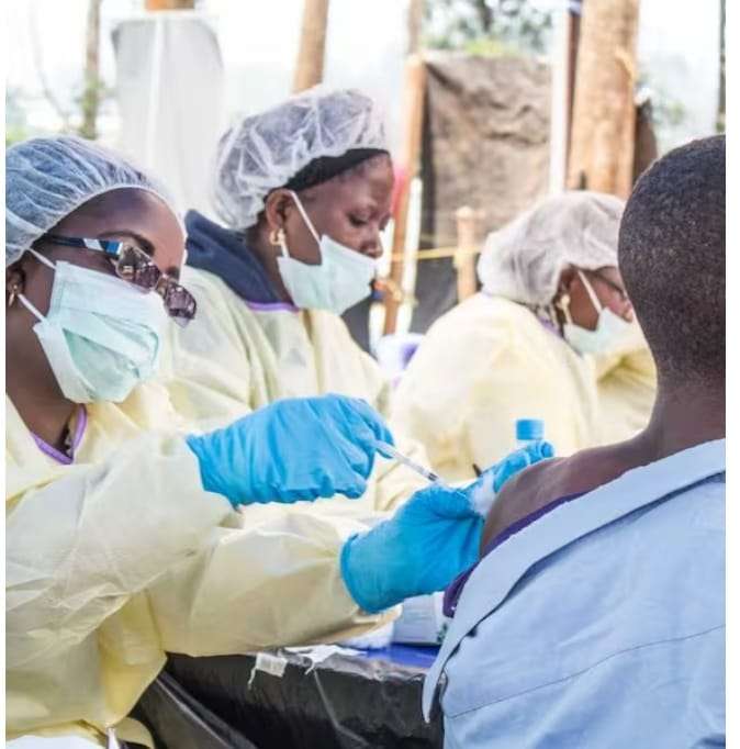 Ebola Vaccine DR Congo health workers administer vaccines during an outbreak response effort.