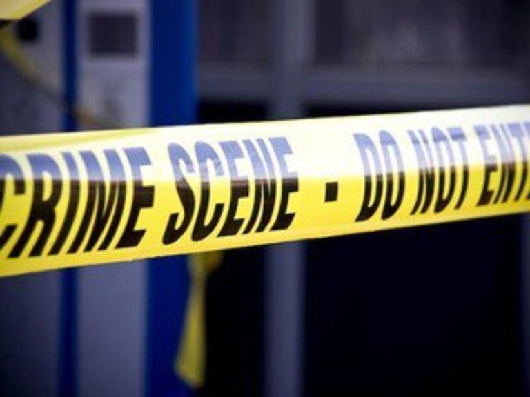 Yellow police tape reading "Crime Scene - Do Not Enter" blocks off an area, symbolizing the growing violence and tragedy linked to Cape Flats shootings.