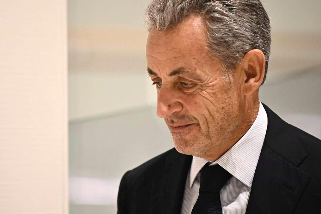 Former French President Nicolas Sarkozy arrives at court in Paris after being sentenced to prison.