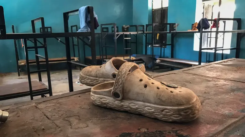 A pair of shoes is seen inside a student dormitory at St. Mary’s Catholic School 
