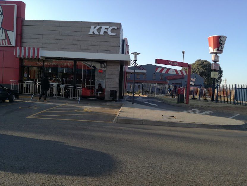 A violent fight outside the Kentucky Fried Chicken (KFC) spilled into the store, forcing staff to lock the doors to protect customers.