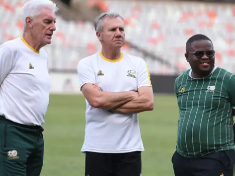 Coach Hugo Broos and His Assistant Coaches on the field.