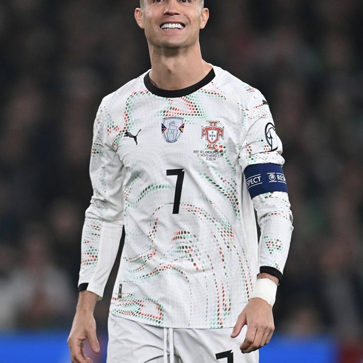 Christiano Ronaldo walking out of the pitch after given a red card.