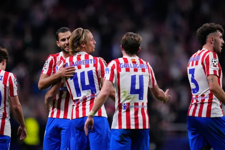 Atletico Madrid players celebrate a goal in UEFA Champions League encounter.