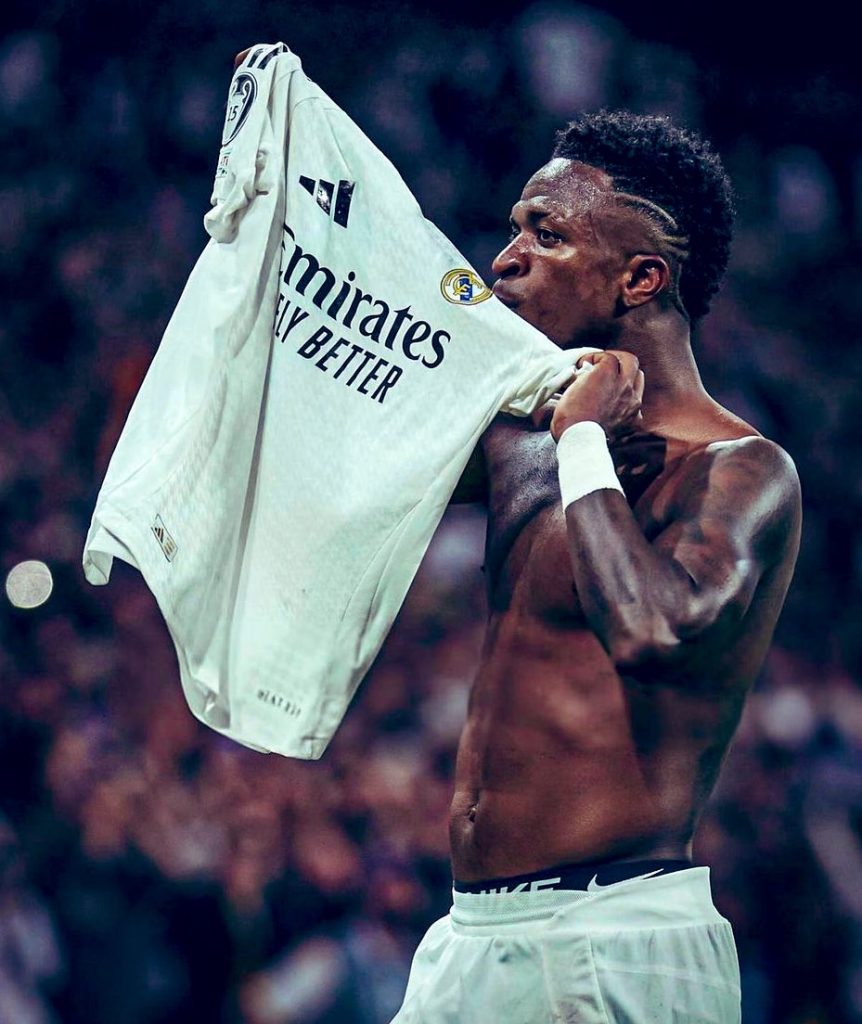 Vinicius Junior celebrates with a shirt off.