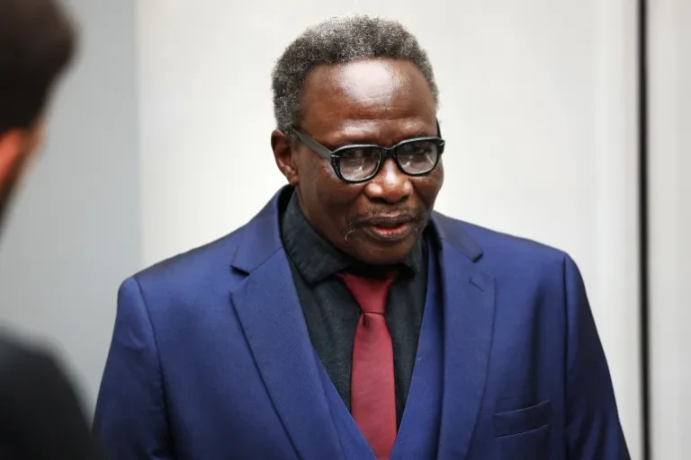 Ali Kushayb, a former Janjaweed militia leader, stands in court during his trial at the International Criminal Court.