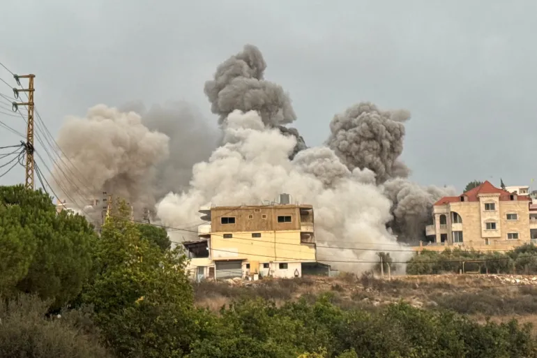 Lebanese civilians inspecting the damage after Israeli airstrikes in southern Lebanon, highlighting the devastating impact on civilian populations.