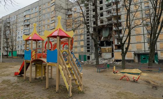 A person walks into a destroyed building in Kupiansk, eastern Ukraine, highlighting the devastating impact of the conflict.