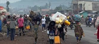 Congolese civilians fleeing their homes amidst violence and displacement in eastern DRC.