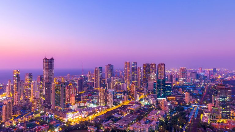 A city building representing India's growing economy and Amazon's investment.